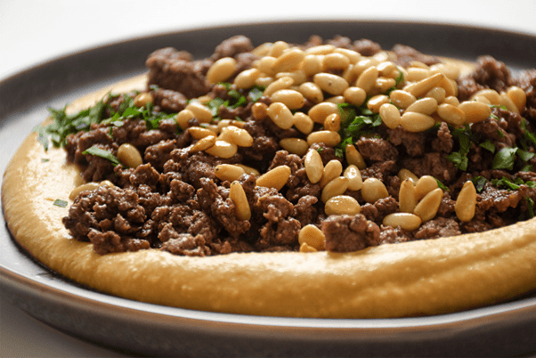 Dakah (Ground Beef) Over Hummus